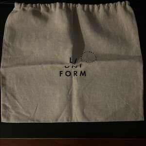 L/UNIFORM Beige Drawstring Bag